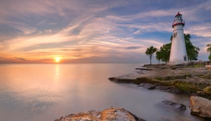 lighthouse by a beautiful sunset